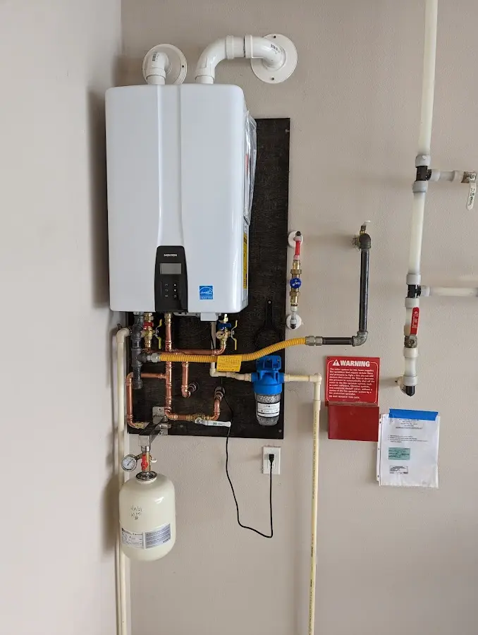 Professional plumber installing copper piping in a Okeechobee home